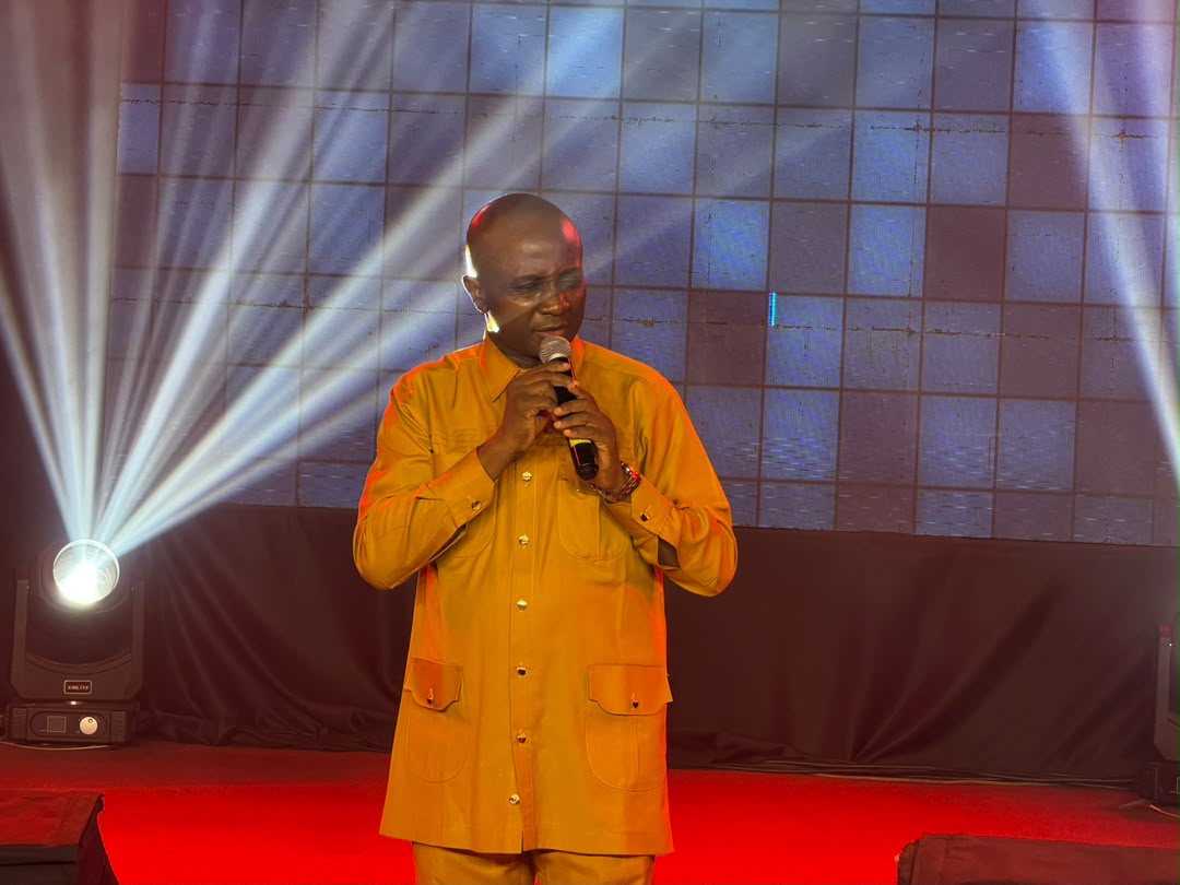 A minister leading the congregation in worship at the altar
