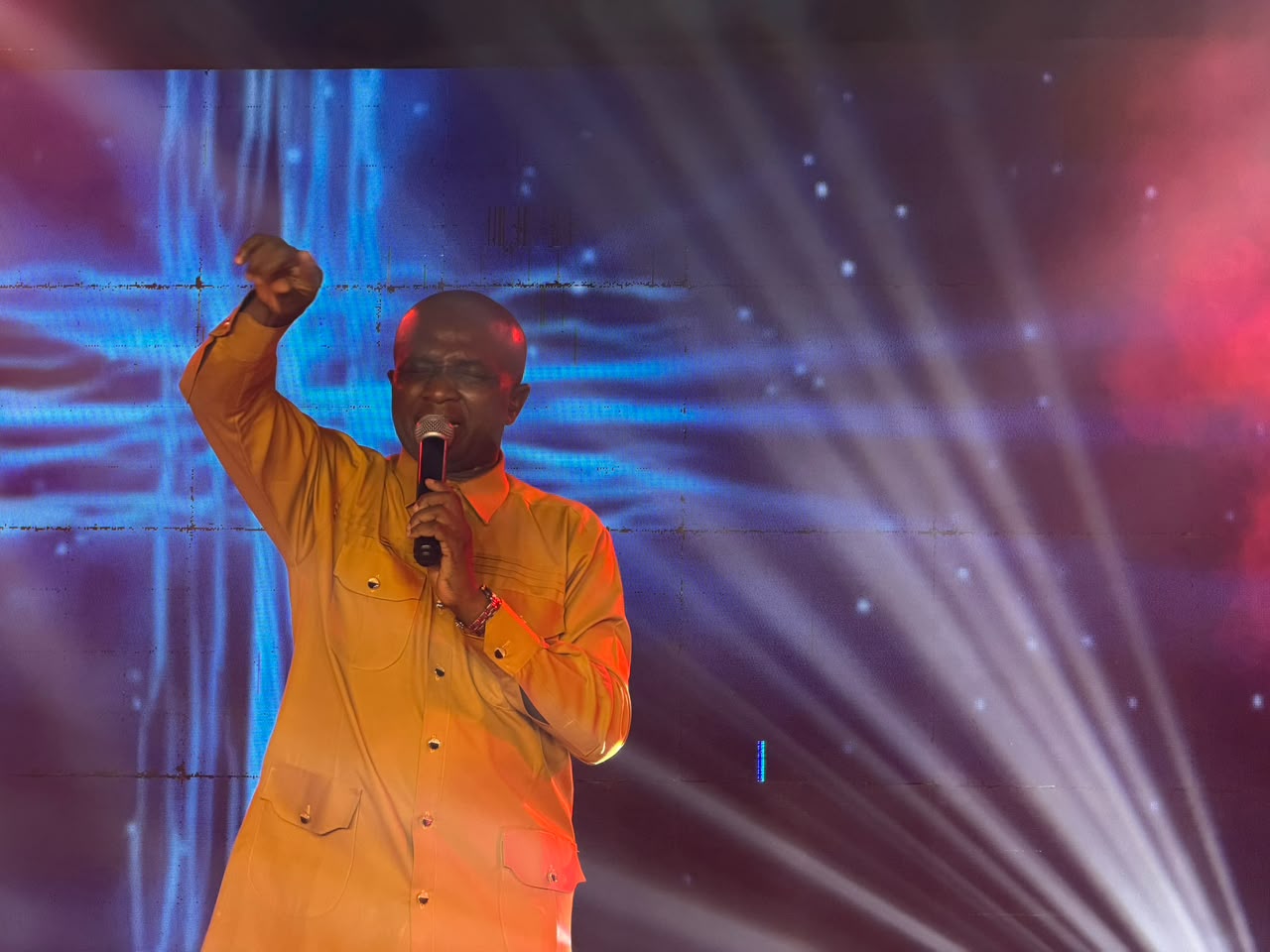 A minister declaring the word with lifted hand